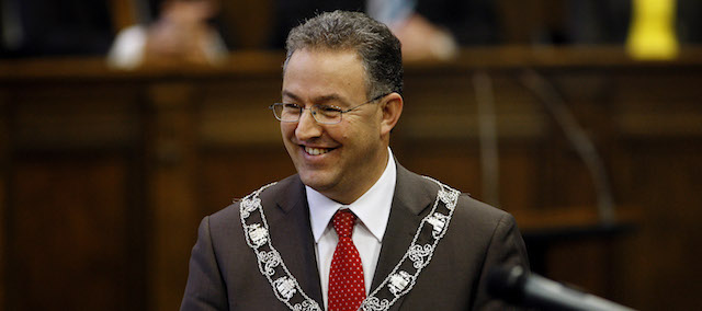 Moroccan-born immigrant Ahmed Aboutaleb, center, wears the chain of office as he is installed as mayor at the city hall in Rotterdam, Netherlands, Monday, Jan. 5, 2009. Ahmed Aboutaleb, who has dual Dutch-Moroccan citizenship, is the first Moroccan-born immigrant to be appointed a Dutch mayor. The city of 585,000 has the largest proportion of immigrants of any major Dutch city. ( AP Photo/ Robert Vos, Pool)