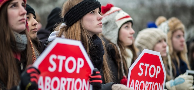 WASHINGTON, DC - JANUARY 25: Anti-abortion protesters attend the March for Life on January 25, 2013 in Washington, DC. The pro-life gathering is held each year around the anniversary of the Roe v. Wade Supreme Court decision. (Photo by Brendan Hoffman/Getty Images) *** Local Caption ***