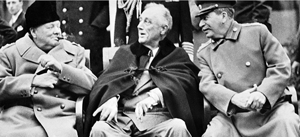 British Prime minister Winston Churchill (L), US president Franklin Delano Roosevelt (C) and USSR Secretary general of the Soviet Communist Party (PCUS), Joseph Stalin (R) pose at the start of the Conference of the Allied powers in Yalta, Crimea, on February 4, 1945 at the end of World War II. During the Yalta Conference, which took place from February 4 to 11, 1945, "The Big Three" (Stalin, Roosevelt, Churchill) decided the demilitarization and denazification of Germany and carved out their own post-war zones of influence accross the globe. (Photo credit should read STF/AFP/Getty Images)