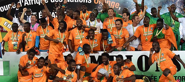 Ivory Coast's players celebrate with the trophy at the end of the 2015 African Cup of Nations final football match between Ivory Coast and Ghana in Bata on February 8, 2015. Ivory Coast won 9 to 8 on penalties. AFP PHOTO / ISSOUF SANOGO (Photo credit should read ISSOUF SANOGO/AFP/Getty Images)