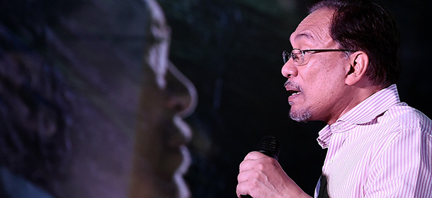 Malaysian opposition leader Anwar Ibrahim gestures while addressing his supporters at a gathering in Kuala Lumpur on February 9, 2015. Malaysia's highest court is expected to deliver a final decision on February 10, on Anwar's appeal against a sodomy conviction and five-year jail term handed down last year. AFP PHOTO / MANAN VATSYAYANA (Photo credit should read MANAN VATSYAYANA/AFP/Getty Images)