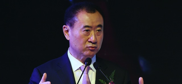 Wang Jianlin, chairman of Wanda Group, speaks at a ceremony in Beijing on February 10, 2015. China's Wanda Group has agreed to buy Infront -- the Swiss sports marketing group headed by Sepp Blatter's nephew and which holds some broadcasting rights to the World Cup -- for 1.05 billion euros (1.2 billion USD), the two firms said on February 10. AFP PHOTO / Greg BAKER (Photo credit should read GREG BAKER/AFP/Getty Images)