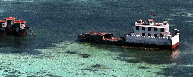 SPRATLY ISLANDS, PHILIPPINES: This aerial photograph taken 01 Arpil 1995 shows several Chinese structures, including a two level concrete fort armed with guns on the rooftop, built in one of the Chinese occupied areas in the western section of the disputed Spratly Islands located in the South China Sea. Philippine Defense Secretary Orlando Mercado charged 09 November that China was engaged in massive construction in the disputed Spratlys as a prelude to "creeping invasion" of all Filipino-claimed areas in the South China Sea. AFP PHOTO/ ROMEO GACAD (Photo credit should read ROMEO GACAD/AFP/Getty Images)