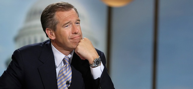 WASHINGTON - JUNE 22: Moderator Brian Williams watches a video which pays tribute to late moderator Tim Russert during a taping of "Meet the Press" at the NBC studios June 22, 2008 in Washington, DC. Williams announced that former Nightly News anchor Tom Brokaw would temporarily host the show until the presidential elections in November, 2008. (Photo by Alex Wong/Getty Images for Meet the Press)