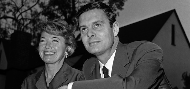 FILE - In this Jan. 5, 1959 file photo, actor Louis Jourdan and his wife Berthe Fredrique pose at their home in Beverly Hills, Calif. Jourdan, the dashingly handsome Frenchman who starred in "Gigi," ''Can-Can," ''Three Coins in the Fountain" and other American movies, has died on Saturday, Feb. 14, 2015. He was 93. (AP Photo, File)
