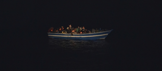 In this photo taken on Friday, Nov. 14, 2014 and provided by the Portoguese Navy, migrants are crammed on a wooden boat off the Lybian coast. The Portuguese open sea patrol vessel the Viana Do Castelo made its first rescue of migrants as part of Operation Triton, the EU operation that has stepped in to help Italy patrol its coastline. A spokeswoman for Frontex, the European Agency that coordinates Triton deployment, told the Associated Press that in recent days Operation Triton has rescued over 600 migrants. The European Operation Triton is taking over from the Italian Operation Mare Nostrum which was launched by the Italian government in October of 2013, following a migrant shipwreck that left over 300 people dead just off the coast of Lampedusa, the small strip of island that is part of Italy but closer to the African mainland. (AP Photo/Portuguese Navy, ho)