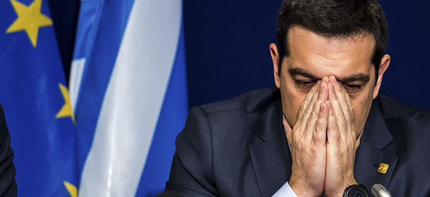 Greek Prime Minister Alexis Tsipras pauses before answering questions during a media conference after an EU summit in Brussels on Thursday, Feb. 12, 2015. European Union leaders on Thursday said the full respect of the planned weekend cease-fire in eastern Ukraine will be essential before there could be a change in the sanctions regime imposed on Moscow. (AP Photo/Geert Vanden Wijngaert)