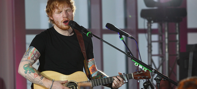 British singer Ed Sheeran performs in the panorama restaurant on Germany's highest mountain the Zugspitze mountain close to Grainau, Germany, Monday Dec. 15, 2014. (AP Photo/dpa,Karl-Josef Hildenbrand)