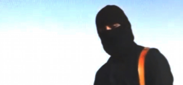 FILE - This image made from video released by Islamic State militants on Aug. 19, 2014 purports to show journalist Steven Sotloff being held by the militant group. On Tuesday, Sept. 2, 2014, an Internet video purports to show the beheading of Sotloff by the Islamic State group. (AP Photo/File)