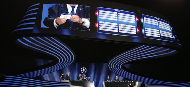 Picture taken during the draw for the 2014/2015 European Champions League group stages, on August 28, 2014 in Monaco. Champions Real Madrid will play five-time former winners Liverpool while fellow Spanish giants Barcelona plucked big-spending Paris Saint-Germain as the Champions League group stage draw was made in Monaco today. But the most mouth-watering draw saw 2013 champions Bayern Munich paired with Manchester City, Roma and CSKA Moscow in Group E. AFP PHOTO / VALERY HACHE (Photo credit should read VALERY HACHE/AFP/Getty Images)