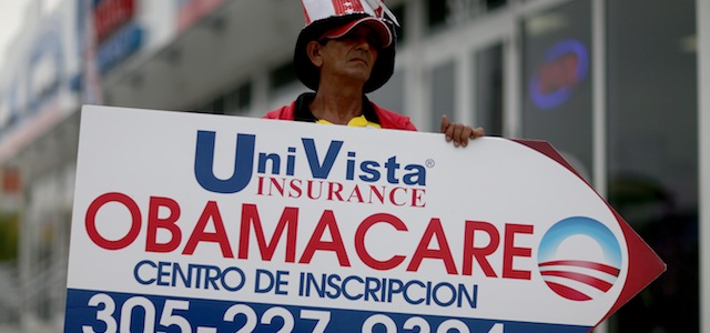 MIAMI, FL - FEBRUARY 05: Oreste Alvarez holds a sign directing people to UniVista Insurance company where they can sign up for the Affordable Care Act, also known as Obamacare, before the February 15th deadline on February 5, 2015 in Miami, Florida. Numbers released by the government show that the Miami-Fort Lauderdale-West Palm Beach metropolitan area has signed up 637,514 consumers so far since open enrollment began on Nov. 15, which is more than twice as many as the next large metropolitan area, Atlanta, Georgia. (Photo by Joe Raedle/Getty Images)