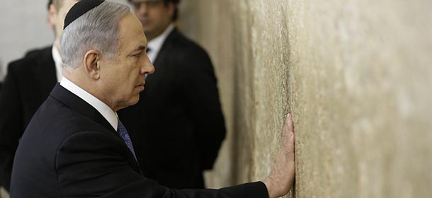 Israeli Prime Minister Benjamin Netanyahu prays on March 18, 2015 at the Wailing Wall in Jerusalem following his party Likud's victory in Israel's general election. Netanyahu swept to a stunning election victory, securing a third straight term for an Israeli leader who has deepened tensions with the Palestinians and infuriated key ally Washington. AFP PHOTO / THOMAS COEX (Photo credit should read THOMAS COEX/AFP/Getty Images)
