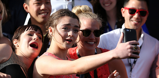 SAN FRANCISCO, CA - MARCH 23: Actress Maisie Williams (C) does a selfie with fans (Justin Sullivan/Getty Images)