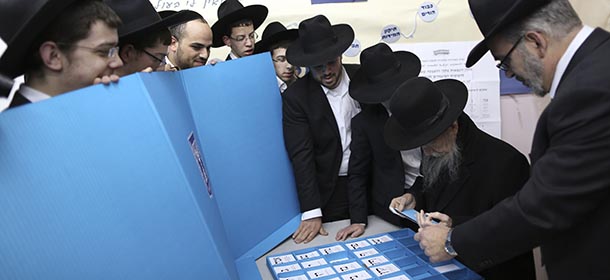 Ultra orthodox Jewish rabbi Gershon Edelstein prepares to vote in Bnei Brak, Israel, Tuesday, March 17, 2015. Israelis are voting in early parliament elections following a campaign focused on economic issues such as the high cost of living, rather than fears of a nuclear Iran or the Israeli-Arab conflict. .(AP Photo/Oded Balilty)