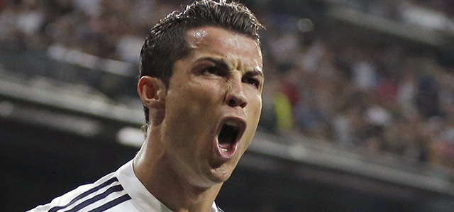 Real Madrid's Cristiano Ronaldo celebrates scoring 2-2 during a Champions League soccer match round of 16 second leg, between Real Madrid and Schalke 04 at Santiago Bernabeu stadium, in Madrid, Spain, Tuesday, March 10, 2015. (AP Photo/Daniel Ochoa de Olza)