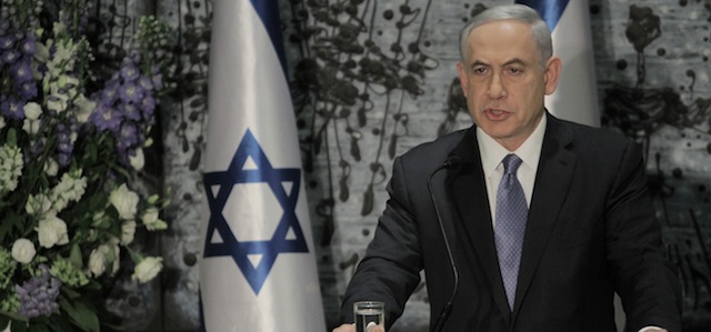 Israeli Prime Minister Benjamin Netanyahu speaks during a ceremony with Israeli President Reuven Rivlin, not seen, in Jerusalem, Wednesday, March 25, 2015. Netanyahu struck a conciliatory tone on Wednesday as he was formally tapped to form a new government, vowing to heal rifts in Israeli society and fix ties with the United States following an acrimonious election campaign. (AP Photo/Dan Balilty)