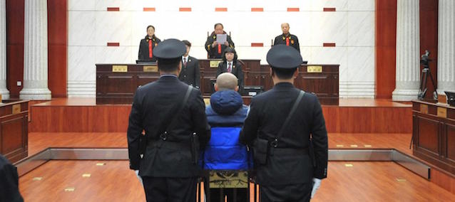 (150209) -- HOHHOT, Feb. 9, 2015 (Xinhua) -- Alleged serial killer Zhao Zhihong stands trial for murder, rape, robbery and larceny at the Hohhot Intermediate People's Court in Hohhot, capital of north China's Inner Mongolia Autonomous Region, Feb. 9, 2015. Zhao Zhihong, 42, was sentenced to death, deprived of political rights for life for murder, rape, robbery and larceny by the court on Monday. Zhao was apprehended in 2005 and confessed to a string of rape and murder cases, including one in a public toilet in Hohhot in 1996 that was pinned on teenager Huugjilt, who was wrongly sentenced and executed for the crime. Huugjilt was exonerated in December 2014. Huugjilt's parents were at the court on Monday. (Xinhua) (lfj)