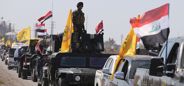 Members of the Iraqi security forces heading from the city of Samarra north of Baghdad drive towards al-Dawr area south of Tikrit to launch an assault against the Islamic State group (IS) on February 28, 2015. Government forces have attempted and failed several times to wrest back Tikrit -- the hometown of former president Saddam Hussein -- since losing it to IS in June last year. AFP PHOTO / AHMAD AL-RUBAYE (Photo credit should read AHMAD AL-RUBAYE/AFP/Getty Images)