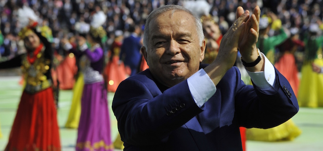 FILE - In this Saturday March 21, 2015 file photo, Uzbekistan's President Islam Karimov greets people during the festivities marking the Navruz holiday, or a sping "New Year" holiday, in Tashkent, Uzbekistan. Uzbekistan is going through the motions of a presidential election this weekend, with a crushing win for its longtime leader a foregone conclusion, but the long-term future of the Central Asian nation is still far from certain. Islam Karimov, 77, has led the double-landlocked former Soviet republic of 30 million people uninterruptedly since the late 1980s. (AP Photo/File)