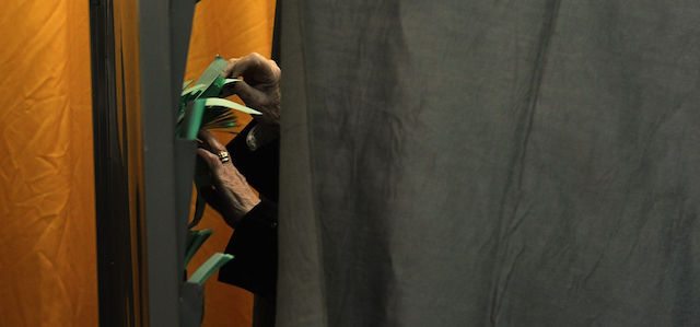 A woman prepares her ballot during regional elections in Sevilla on March 22, 2015. Two parties, ruling Popular Party and Socialist Party (PSOE), have taken turns to govern Spain since the 1980s but now face a rival pair of surging protest movements, radical left wing Podemos and centre right party Cuidadanos, in a dress rehearsal for the national polls due around November. The vote in Andalusia, one of the poorest parts of Spain, will be a key test ahead of the country's most unpredictable general election in decades. AFP PHOTO / CRISTINA QUICLER (Photo credit should read CRISTINA QUICLER/AFP/Getty Images)