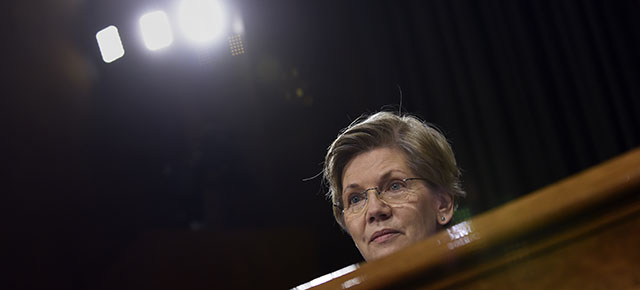 Senate Banking Committee member, Sen. Elizabeth Warren, D-Mass., listens to testimony on Capitol Hill in Washington, Tuesday, Feb. 24, 2015, from Federal Reserve Board Chair Janet Yellen. Yellen said Tuesday that the U.S. economy is making steady progress, but the Fed remains patient in raising interest rates because too many Americans are still unemployed, wage growth remains sluggish and inflation is too low. (AP Photo/Susan Walsh)