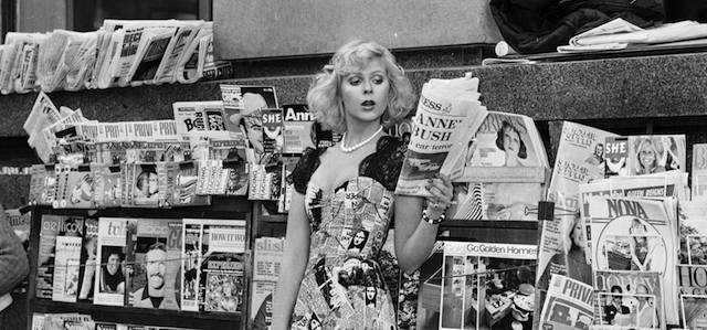 April 1974: A model wearing a dress with a newspaper print design. (Photo by D. Morrison/Express/Getty Images)