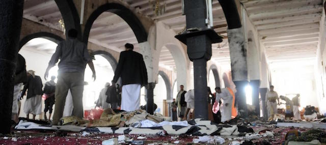 (150320) -- SANAA, March 20, 2015 (Xinhua) -- People clear a mosque after a suicide bomb attack in Sanaa, Yemen, March 20, 2015. A total of 88 people were killed and at least 100 others wounded on Friday in four bomb attacks in Yemen, local sources told Xinhua. (Xinhua/Hani Ali)