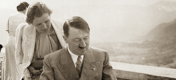 Left to right: photographer Heinrich Hoffmann (1885 ñ 1957), Eva Braun (1912 - 1945) and Adolf Hitler (1889 ñ 1945) at Hitler's residence, the Berghof near Berchtesgaden, Germany, 1942. Hitler and Braun are looking at photos Hoffmann has brought along. Hoffmann was the official photographer for the Nazi Party (NSDAP) and Eva Braun had worked for his agency, where she met Hitler in 1929. Berchtesgaden, Germany.(Photo by Galerie Bilderwelt/Getty Images)
