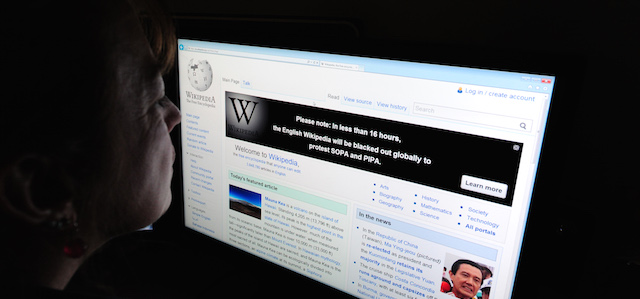 A journalist reads information on the online encyclopedia Wikipedia on Jauary 17, 2012 in Washington, DC. Free online knowledge site Wikipedia will shut down for 24 hours beginning at midnight eastern standard time in protest at draft anti-online piracy legislation before the US Congress, founder Jimmy Wales said Monday on Twitter. AFP PHOTO/Karen BLEIER (Photo credit should read KAREN BLEIER/AFP/Getty Images)