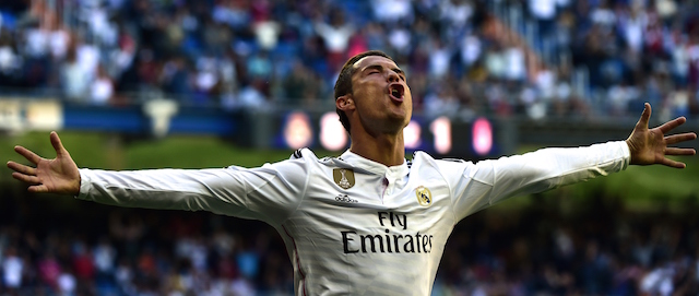 Real Madrid's Portuguese forward Cristiano Ronaldo celebrates a goal during the Spanish league football match Real Madrid CF vs Granada FC at the Santiago Bernabeu stadium in Madrid on April 5, 2015. AFP PHOTO/ GERARD JULIEN (Photo credit should read GERARD JULIEN/AFP/Getty Images)