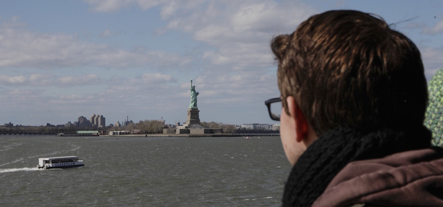A man looks at the Statue of Liberty and the island it sits on after it was evacuated because of a suspicious package in New York on April 24, 2015. New York police said the island was cleared of visitors by 2:00 pm (1800 GMT) and a special team of explosives experts was sent to the island. AFP PHOTO / KENA BETANCUR (Photo credit should read KENA BETANCUR/AFP/Getty Images)