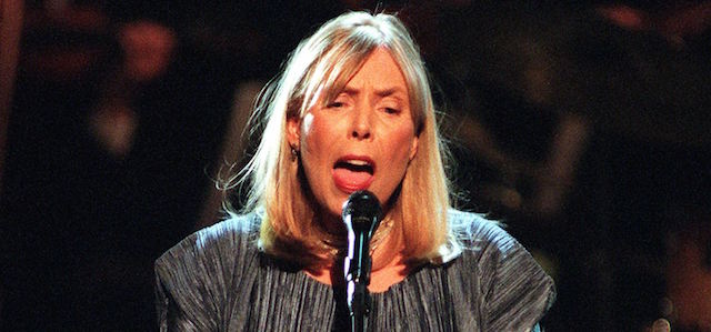 NEW YORK, UNITED STATES: Singer and songwriter Joni Mitchell performs onstage during the finale of Turner Network Television's "All-Star Tribute to Joni Mitchell" at the Hammerstein Ballroom 06 April, 2000 in New York City. The event featured numerous singers and musicians performing Mitchell songs. AFP PHOTO Matt CAMPBELL (Photo credit should read MATT CAMPBELL/AFP/Getty Images)