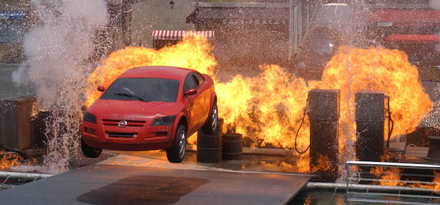 ** FOR IMMEDIATE RELEASE **A car leaps over flames and water gushes at Walt Disney World's new attraction "Lights, Motor, Action! Extreme Stunt Show" in Lake Buena Vista, Fla., May 11, 2005. After a few years of belt-tightening, theme and amusement park owners have spent big bucks following their strongest attendance year since 2001 terrorist attacks caused the $10.8 billion industry to lose momentum. (AP Photo/Peter Cosgrove)