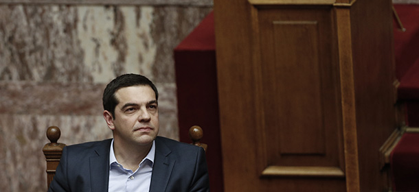 Greece's Prime Minister Alexis Tsipras attends a parliamentary session in Athens, on Monday, March 30, 2015. Tsipras called the special session of parliament to brief lawmakers on the course of recent troubled negotiations with bailout lenders to overhaul cost-cutting reforms. Greece is under pressure to convince creditors it has viable alternatives to the reforms, with government cash reserves running low. (AP Photo/Petros Giannakouris) (