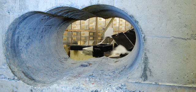 Photo released by British police on April 22, 2015 shows the giant hole robbers drilled to break into a vault in London's major jewelry district several weeks earlier. The robbers made off with an estimated 200 million pounds worth of jewels and cash in one of Britain's biggest jewelry heists. (Kyodo)
==Kyodo