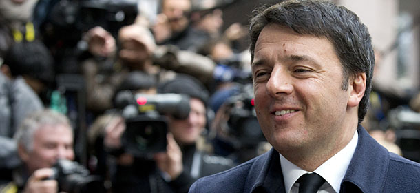 Italian Prime Minister Matteo Renzi arrives for an EU summit in Brussels on Friday, March 20, 2015. EU leaders on Friday are looking to back U.N.-brokered efforts to form a national unity government in conflict-torn Libya that may include a possible mission to help provide security. (AP Photo/Francoise Mori)