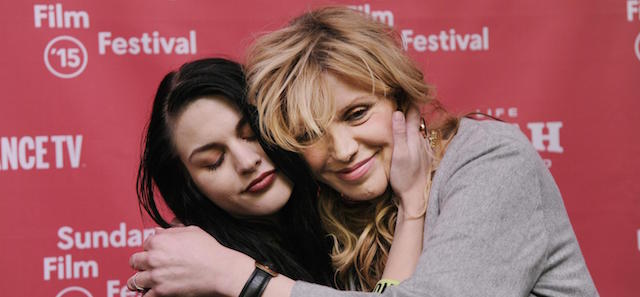 Frances Bean Cobain, left, daughter of Kurt Cobain and executive producer of the documentary film "Kurt Cobain: Montage of Heck," embraces her mother and Cobain's widow Courtney Love at the premiere of the film at The MARC Theatre during the 2015 Sundance Film Festival on Saturday, Jan. 24, 2015, in Park City, Utah. (Photo by Chris Pizzello/Invision/ANSA/AP)