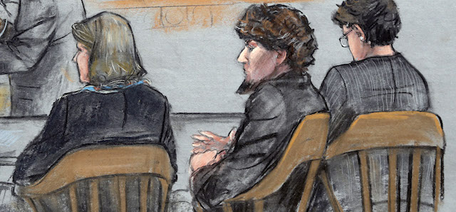 In this courtroom sketch, Assistant U.S. Attorney Aloke Chakravarty, left, is depicted addressing the jury as defendant Dzhokhar Tsarnaev, second from right, sits between his defense attorneys during closing arguments in Tsarnaev's federal death penalty trial Monday, April 6, 2015, in Boston. Tsarnaev is charged with conspiring with his brother to place two bombs near the Boston Marathon finish line in April 2013, killing three and injuring 260 people. (AP Photo/Jane Flavell Collins)