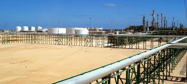 FILE - An undated handout file picture made available by the Eni press office, shows the new Eni (The Italian oil and gas company) gas compression plant on the shore of Mellitah, Libya. The chief of Eni, the biggest gas exporter from Libya, said Thursday, March 10, 2011, that oil production across the battle-torn country is near a complete halt and that the Italian company's output is down to little more than supplying power to Libyan households. Libyan exports normally account for around 2 percent of world supplies, but the violent clashes between forces loyal to longtime leader Moammar Gadhafi and rebels have split the country in half and crippled its lucrative energy sector. (AP Photo/Eni Press office, File)