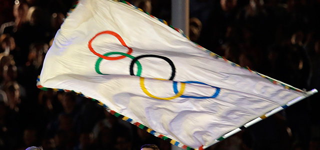 The mayor of Rio de Janeiro Eduardo Paes waves the Olympic flag after it was handed to him by President of the International Olympic Committee Jacques Rogge, not seen, during the Closing Ceremony at the 2012 Summer Olympics, Sunday, Aug. 12, 2012, in London. (AP Photo/Matt Dunham)
