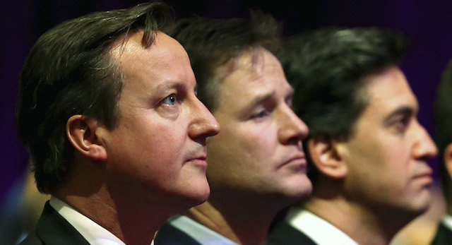 Britain's Prime Minister David Cameron, with Deputy Prime Minister Nick Clegg and Leader of the opposition Labour Party, Ed Miliband attend a Holocaust Memorial Day ceremony at Central Hall Westminster, Tuesday Jan. 27, 2015, in London. The event in London with invited guests and dignitaries marks the International Holocaust Remembrance Day and commemorates the 70th anniversary of the liberation of the Nazi Auschwitz death camp. (AP Photo / Chris Jackson, Pool)