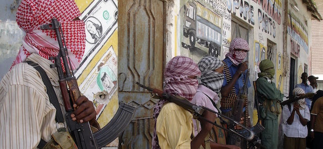 Al-Shabaab insurgents seen with arms, in Mogadishu, Somalia, Saturday Dec. 27, 2008. Clashes between two rival Islamist militias in a central Somali town have killed at least ten people, witnesses said Saturday, as speculation continued over whether the president of Somalia's ineffectual U.N.-backed government would resign. (AP Photo/Farah Abdi Warsameh)