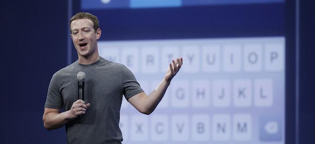 CEO Mark Zuckerberg talks about the Messenger app during the Facebook F8 Developer Conference Wednesday, March 25, 2015, in San Francisco. Facebook is trying to mold its Messenger app into a more versatile communications channel as smartphones create new ways for people to connect with friends and businesses beyond the walls of the company's ubiquitous social network. (AP Photo/Eric Risberg)