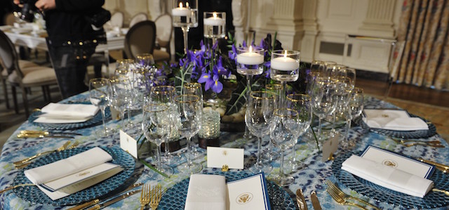 Place settings for the upcoming State Dinner in honor of French President Francois Hollande are displayed during a preview in the State Dining Room of the White House on February 10, 2014 in Washington,DC. AFP PHOTO/Mandel NGAN (Photo credit should read MANDEL NGAN/AFP/Getty Images)