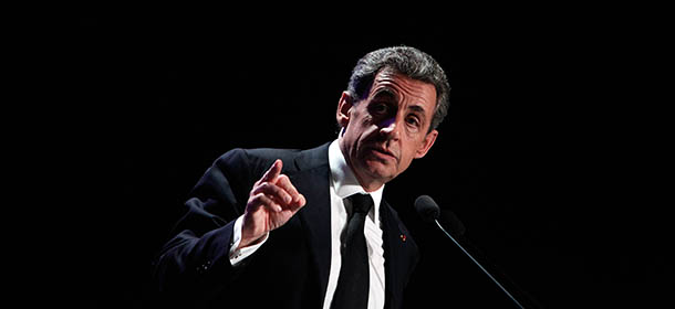 Former French President and conservative party UMP leader Nicolas Sarkozy gives a speech during a meeting in Asnieres, France, Tuesday March 24, 2015. The top two parties in weekend local elections were the conservative UMP and the far right National Front. (AP Photo/Thibault Camus)