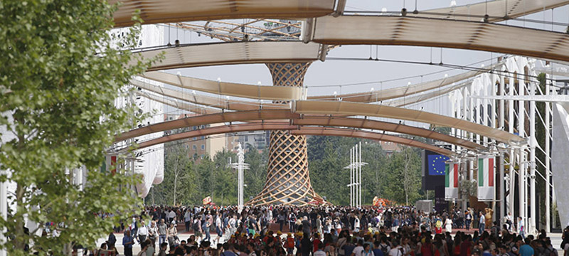 Visitors walk at the Expo 2015 in Rho, near Milan, Italy, Tuesday, May 12, 2015. The Expo opened Friday May 1 for a six-month run and its theme is "Feeding the Planet, Energy for Life". (AP Photo/Luca Bruno)