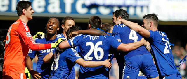 Chelsea players celebrate after the English Premier League soccer match between Chelsea and Crystal Palace at Stamford Bridge stadium in London, Sunday, May 3, 2015. Chelsea won the match 1-0 to secure Premier League title with 3 games to spare. (AP Photo/Alastair Grant)