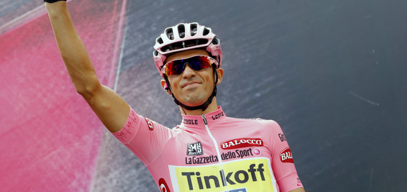 Spanish cyclist and Pink Jersey wearer Alberto Contador, of the Tinkoff Saxo team, waves to the crowd in Turin on May 31, 2015 before the start of the last stage of the 98th Giro d'Italia, Tour of Italy, cycling race, 178 kms between Turin and Milan. AFP PHOTO / LUK BENIES (Photo credit should read LUK BENIES/AFP/Getty Images)