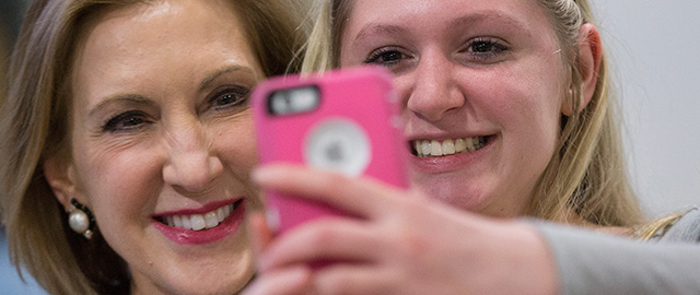 TIFFIN, IA - APRIL 24: Former business executive Carly Fiorina (L) poses for a selfie with Ashlynn Dale at the Johnson County Republicans Spaghetti Dinner at Clear Creek Amana High School on April 24, 2015 in Tiffin, Iowa. Fiorina is considered a potential contender for the 2016 Republican presidential nomination. (Photo by Scott Olson/Getty Images)