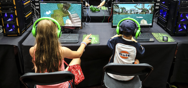 ASCOT, ENGLAND - AUGUST 09: Young racegoers play in a Minecraft tournament during Ascot Dubai Duty Free Shergar Cup and Concert at Ascot Racecourse on August 9, 2014 in Ascot, England. (Photo by Miles Willis/Getty Images for Ascot Racecourse)